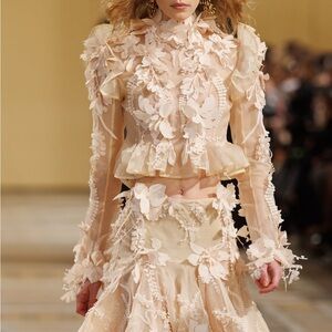 ZIMMERMANN
Hypnotic floral-appliqué silk blouse